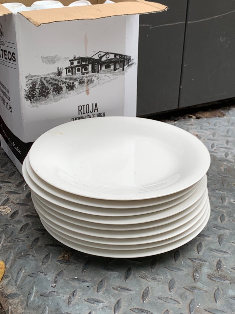 A bunch of plates end cups. A bit dirty