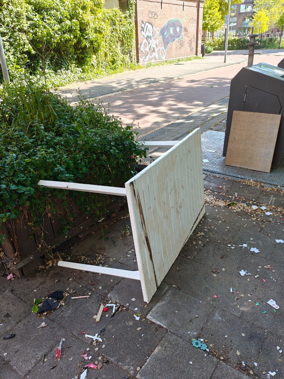 Outside garden table white. Has grown stripe.