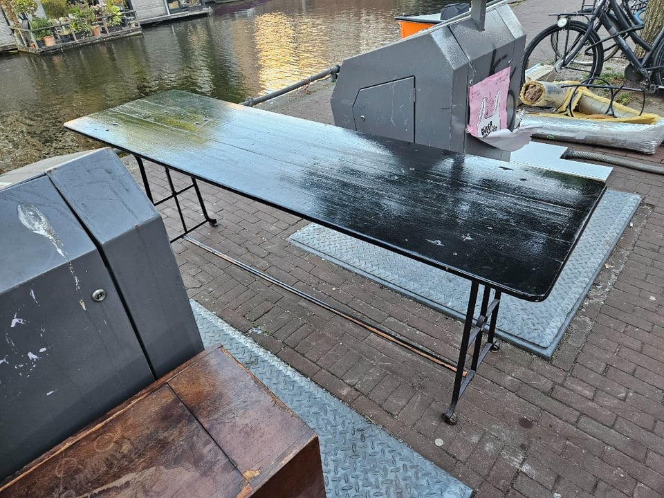 Black wooden table with metal frame