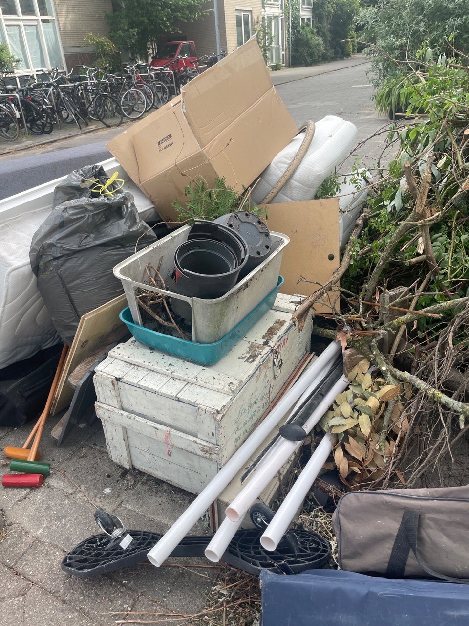 Indoor chair, outdoor chair, door and a nice wooden box that needs some love