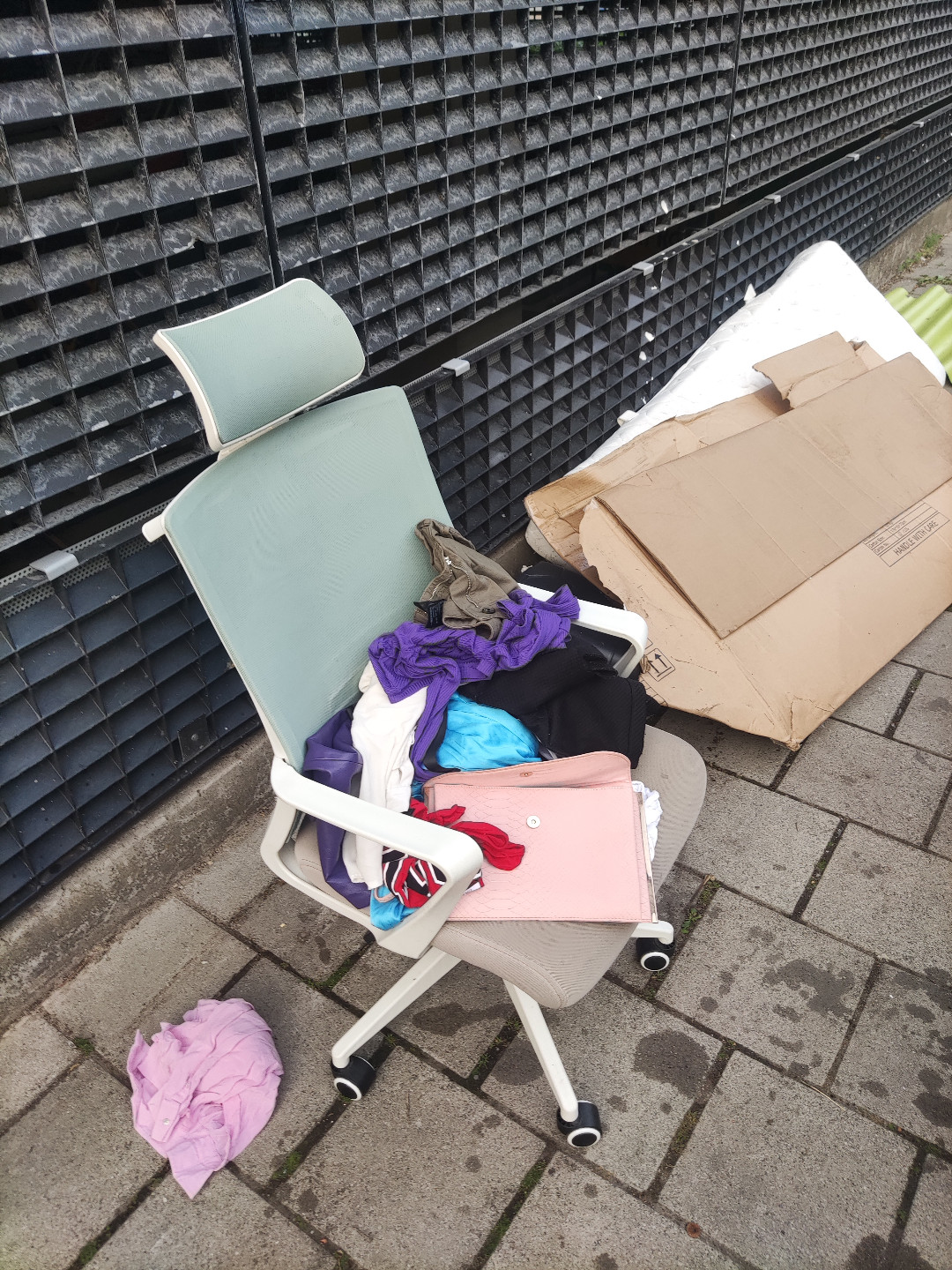 Office chair. Unknown brand. Integrated coat hanger on the back.