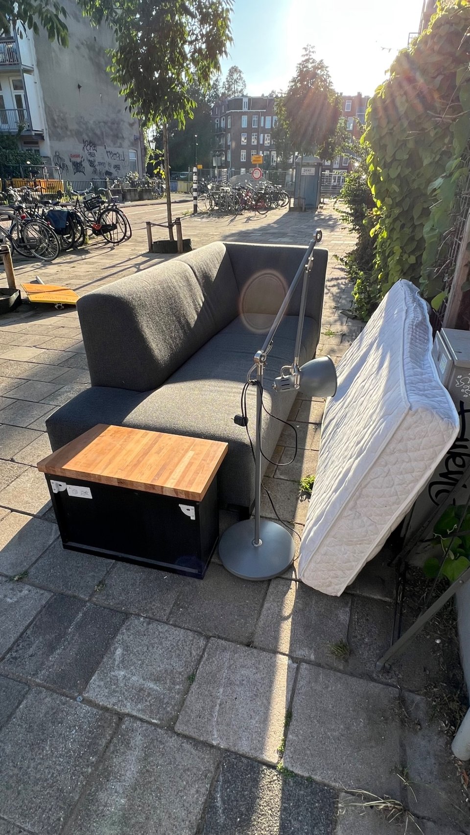 A cozy corner. The lamp is missing a screw part, it looks like part can be removed and attached to the rest of the structure.