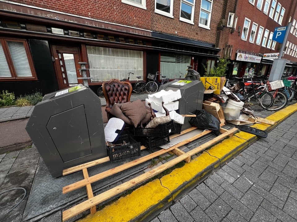 Antique leather armchair, foot rest, carpet, kitchenware