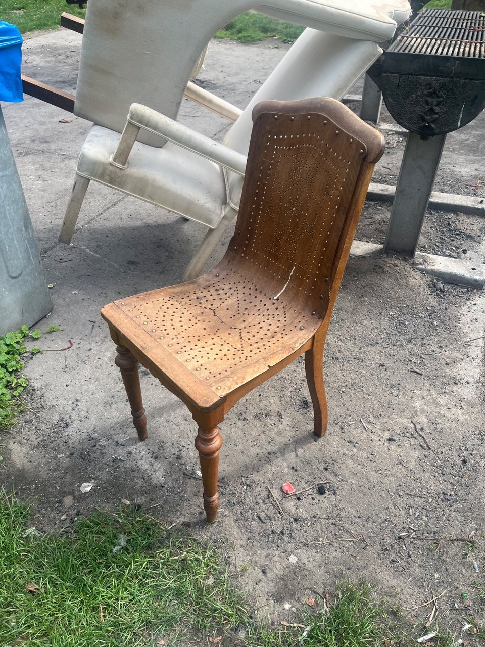 Single wooden chair, a bit beaten up