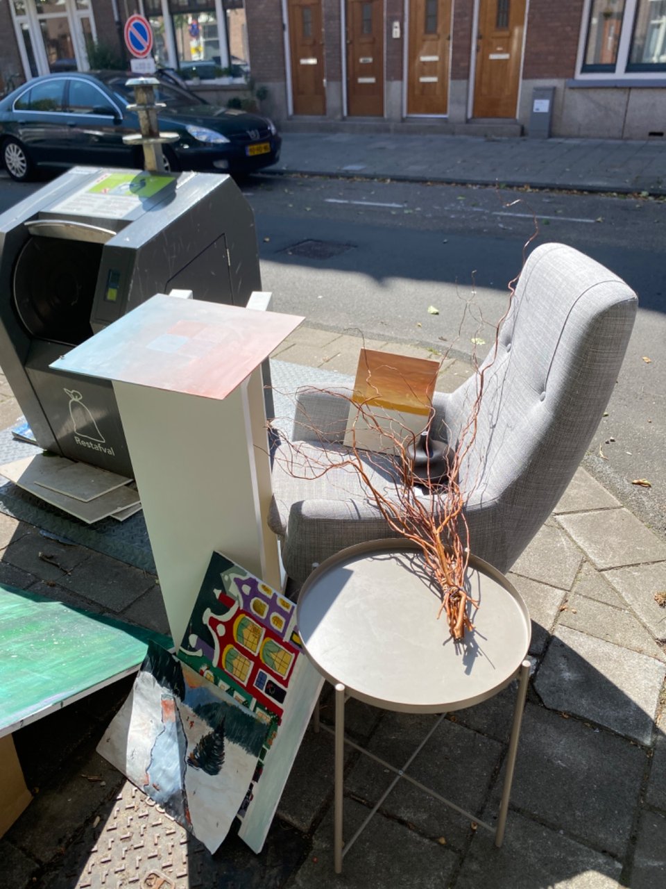 Chair, essential oil diffuser, canvases, side table, and long table. All looks in great condition