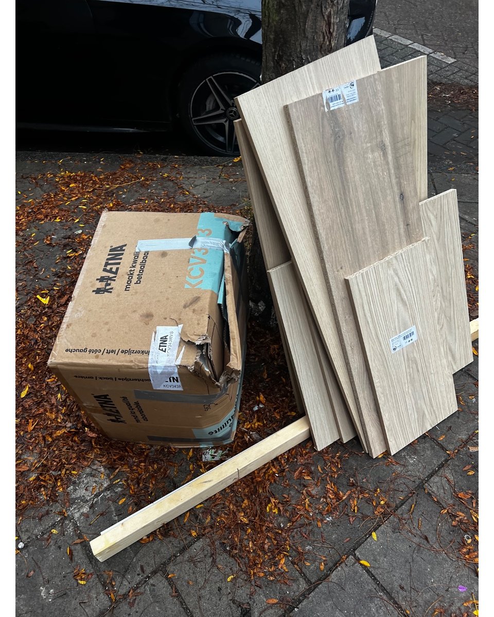 Pressed wood, also in box (did not open fully because of rain)