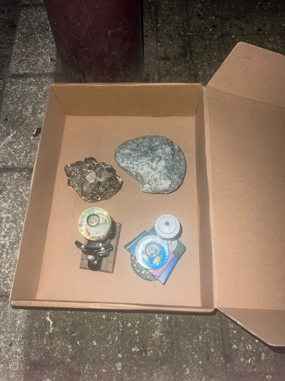 2 snow globes, a rock and a crystal.