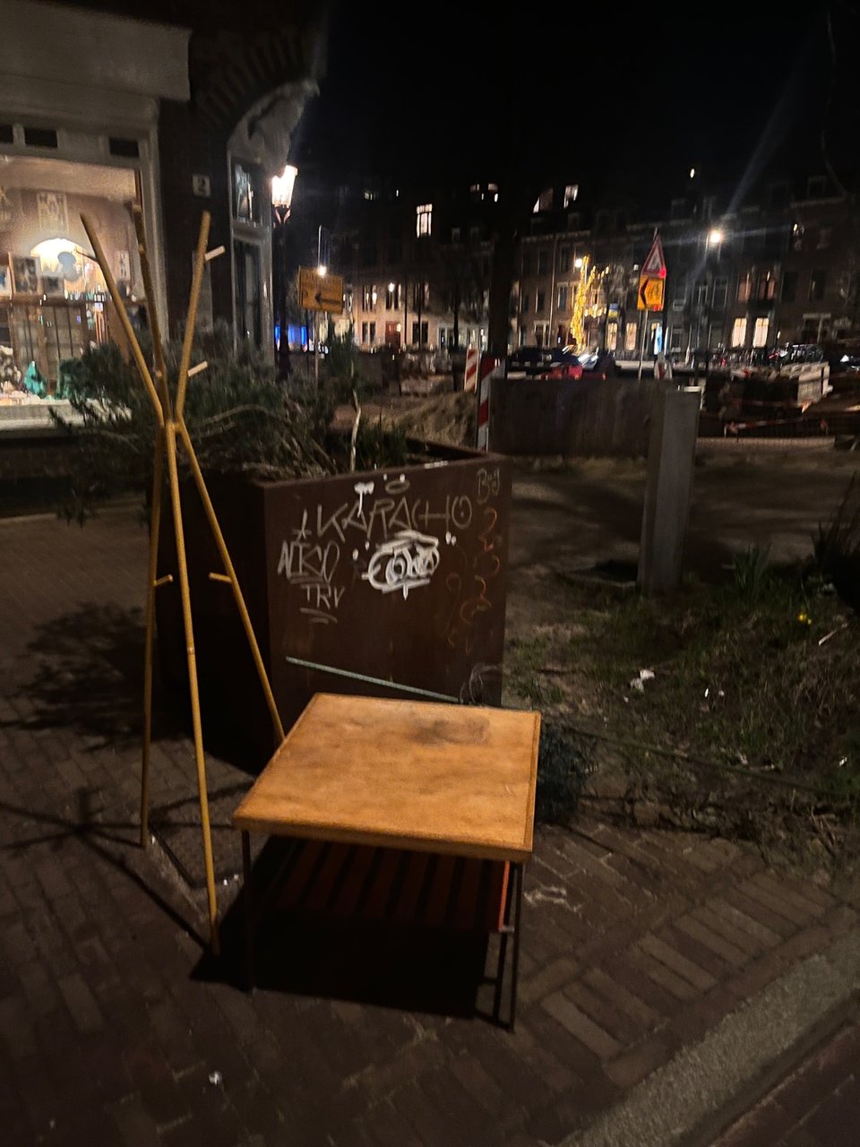 Yellow portmanteau and metal coffee table with oak-veneered top that needs a bit of love