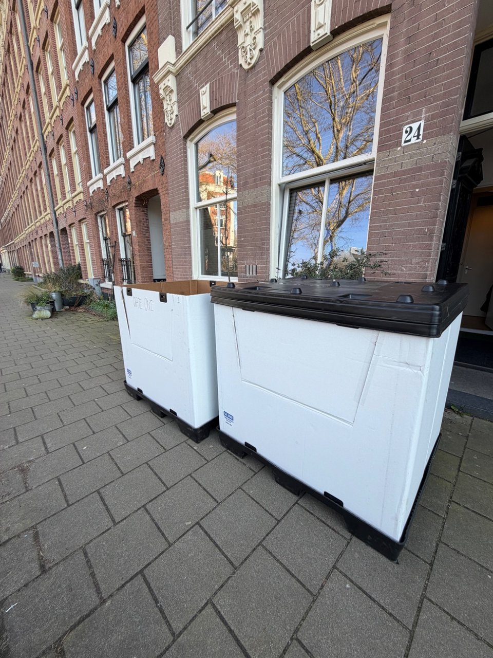 Reusable pallets with tops. Used once for air freight.