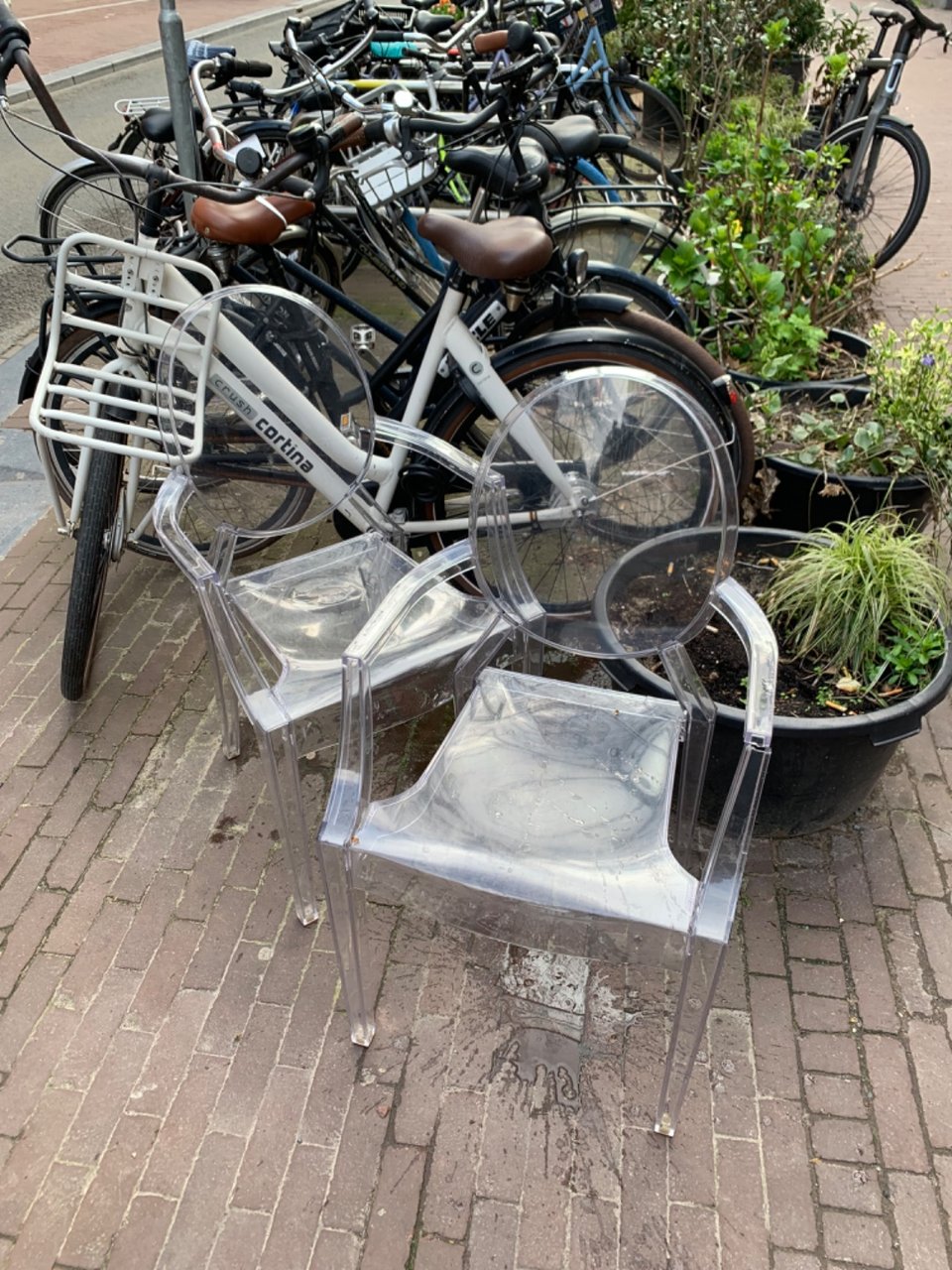 2 Kartell chairs. Both have small cracks