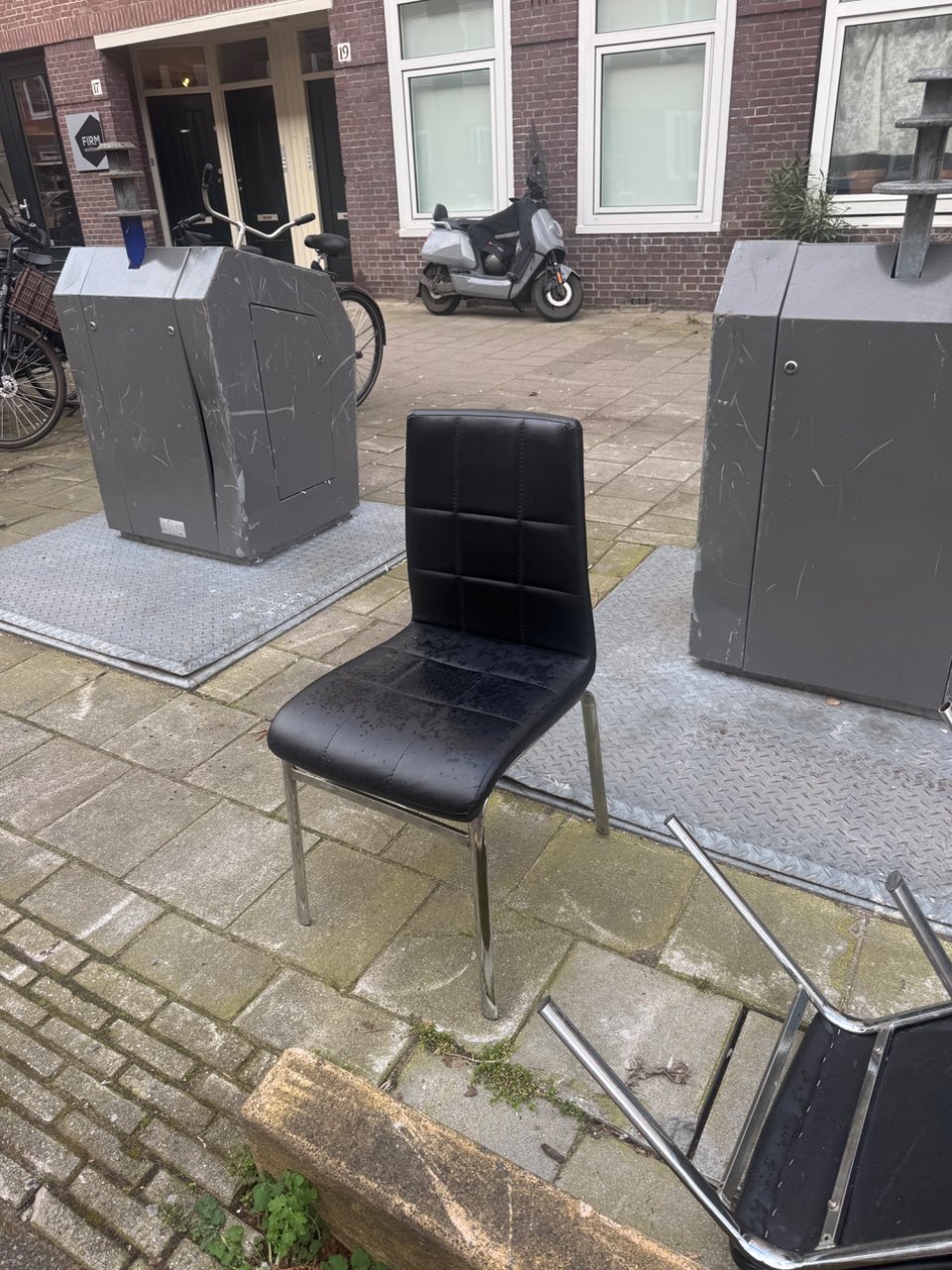 3 black leather chairs with chrome