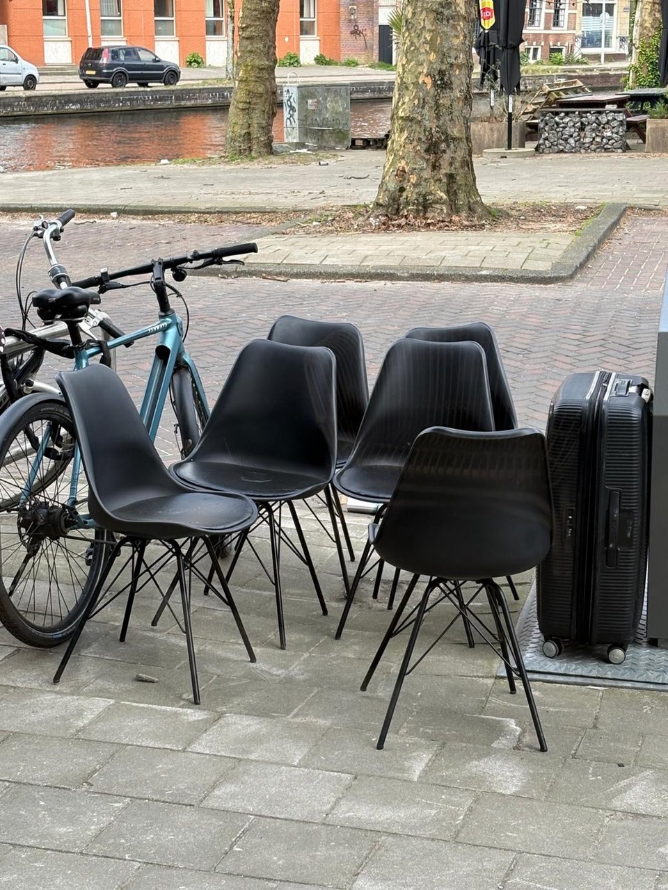 6 black chairs infront of DISSTUDIO.  Amstelveenseweg 2 
(Don’t know why I can’t change it on the adress)