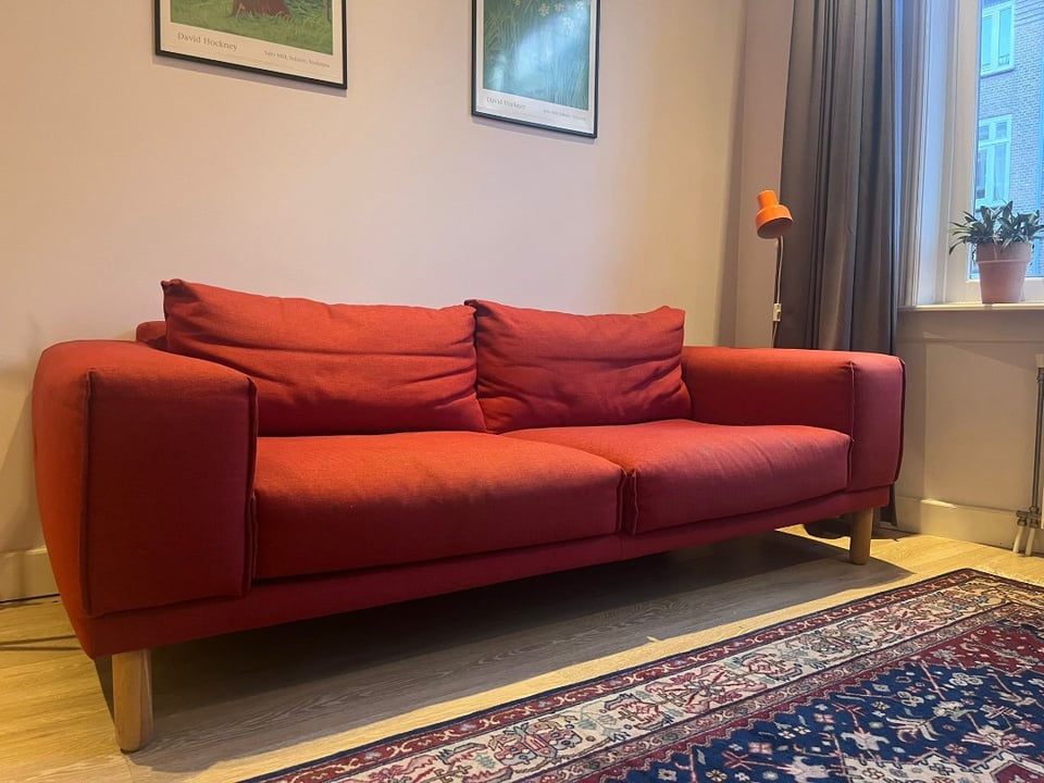Still good quality! Comfy red couch, fits 3 people