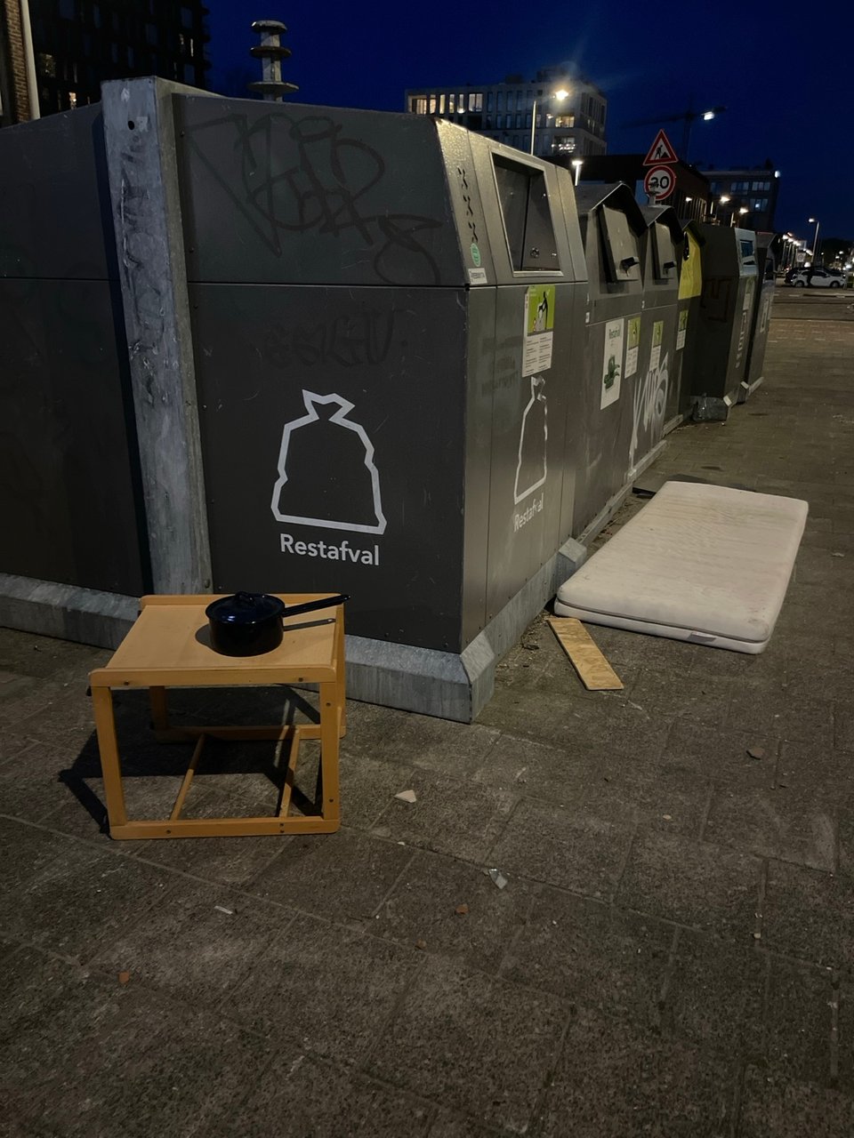 Single bed mattress, kobalt blue pot, brown bed side table