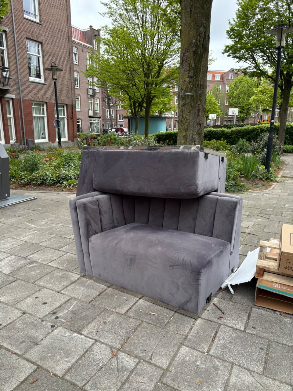 Grey velvet couch with silver trip