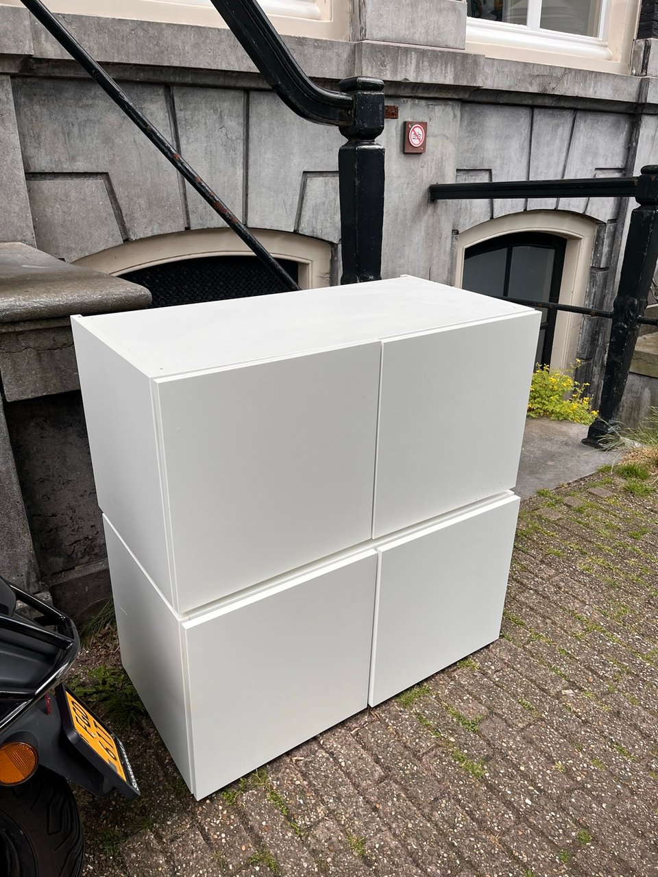 2 white storage units