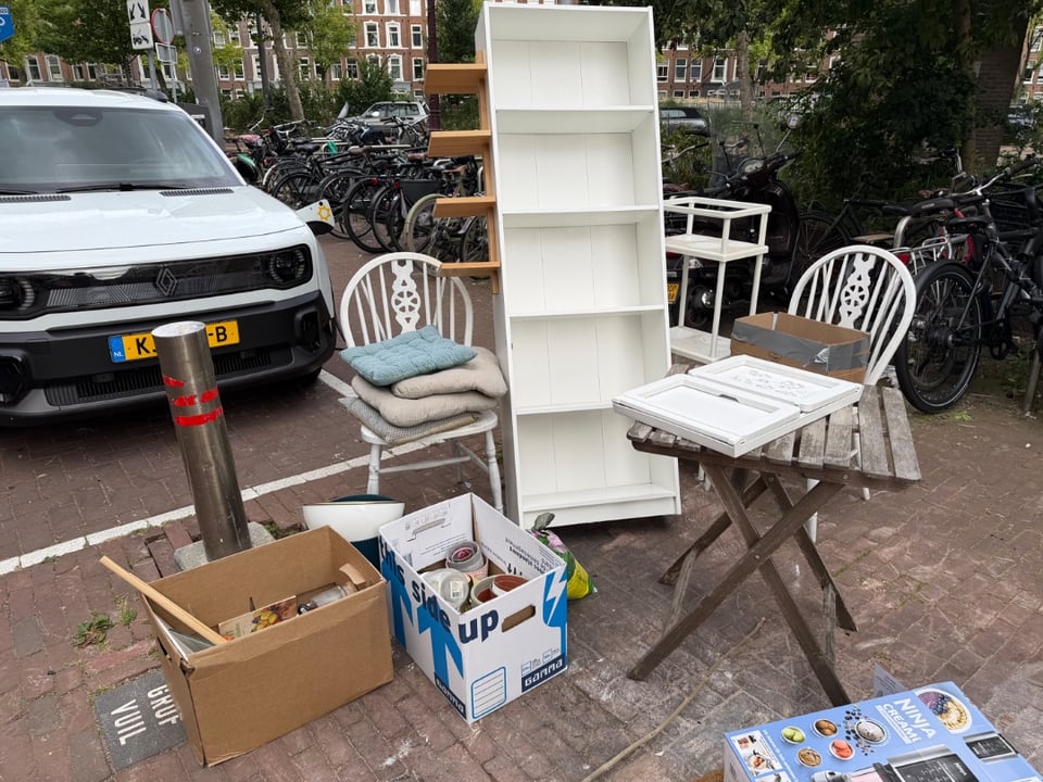 Bookcases,
Table and chairs and cushions,
Flower pots,
Ikea bed table