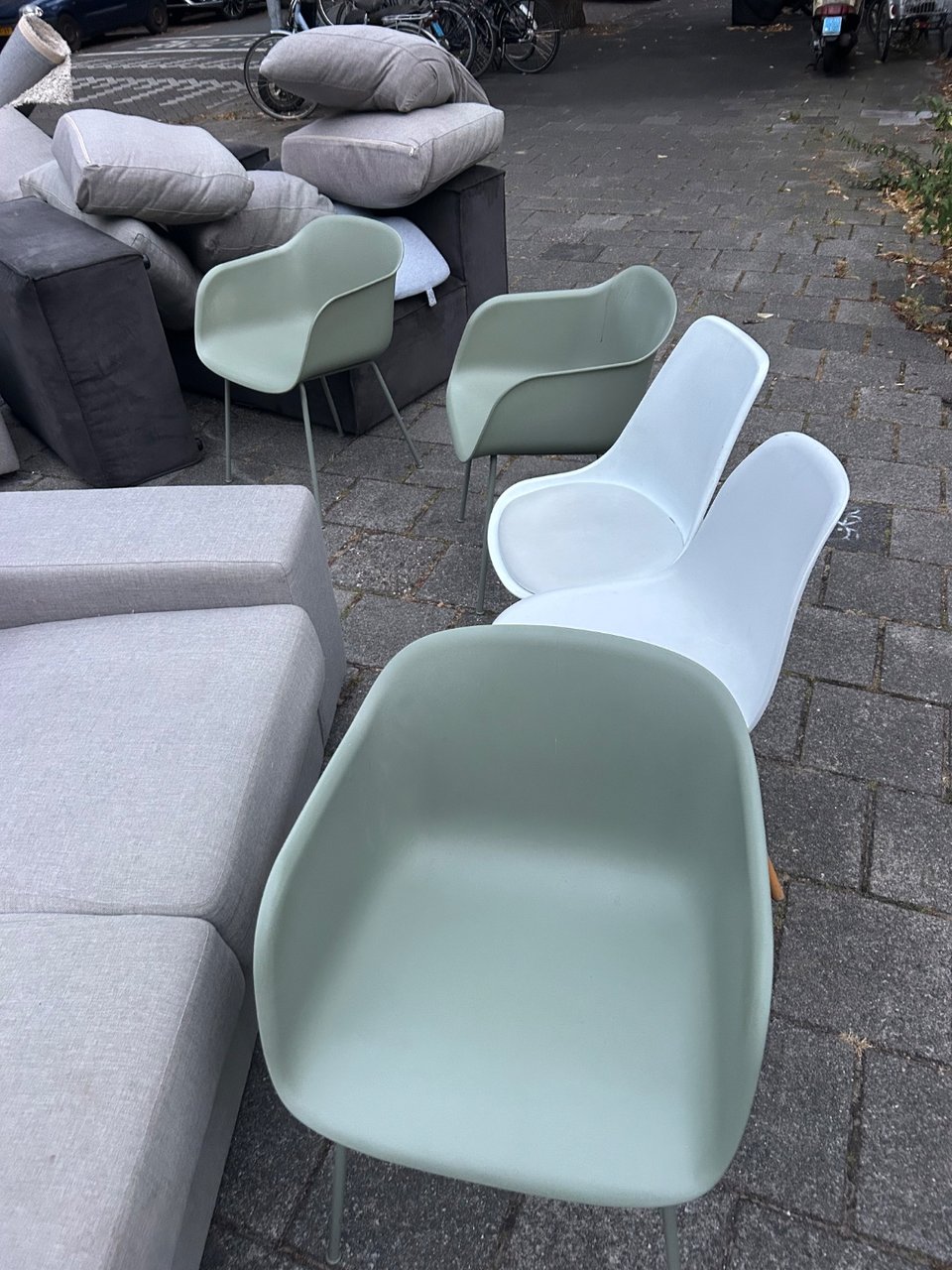 Five chairs, green ones are slightly broken