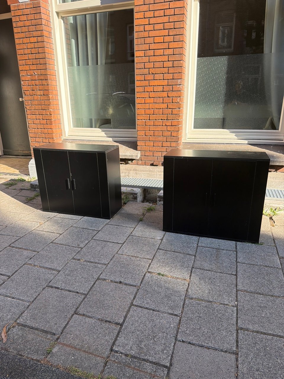 Two black cabinets