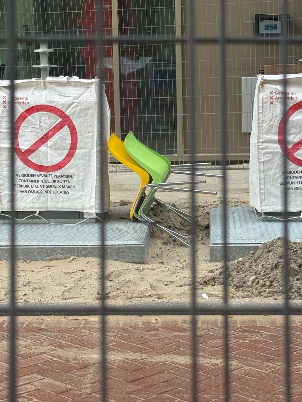 2 cool chairs. Will be there for a while probably as there is fencing around them and the containers are closed. The fence can be moved though if you wanna take them
