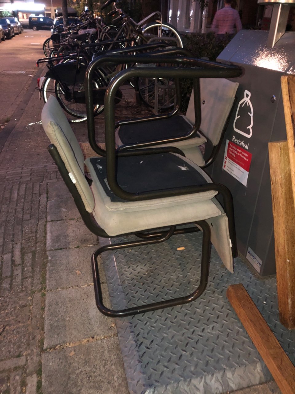 4 chairs, a wooden table an IKEA cupboard and plastic storage unit.