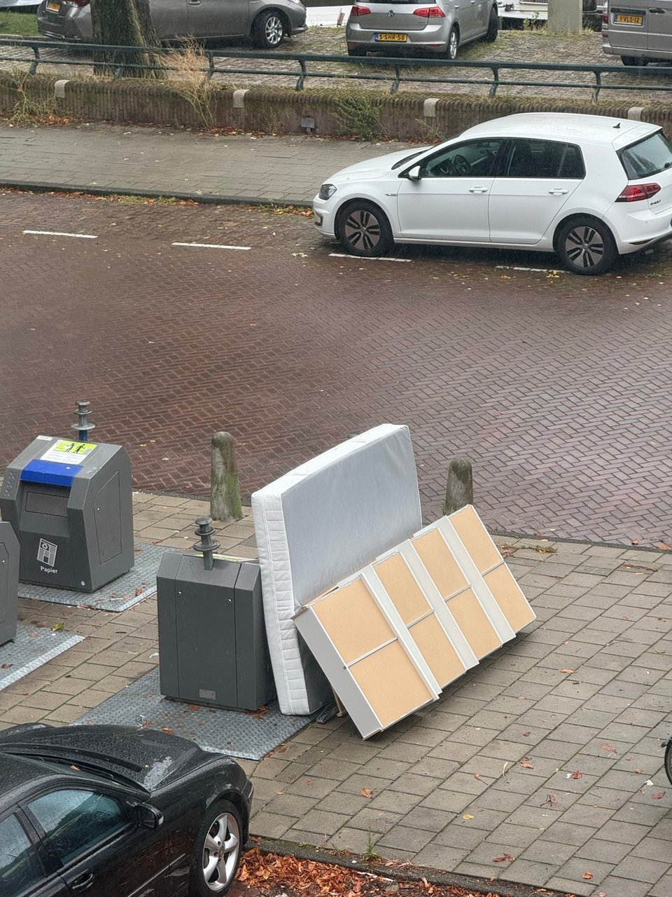Disassembled bed and mattress on the side of the street!