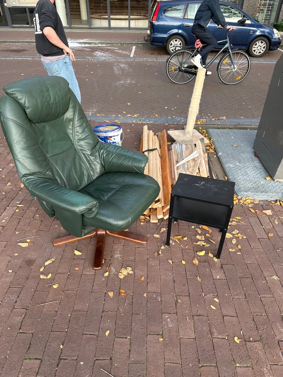 Green leather recliner and side table. Both need love but the recliner is amazing. Near ten western cafe